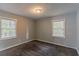 Spacious bedroom featuring neutral walls, carpet, and two windows at 1784 Danrich Dr, Decatur, GA 30032