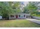 Ranch home with red door and landscaped yard at 1784 Danrich Dr, Decatur, GA 30032