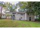View of the home's backyard, showcasing a grassy area and trees at 1784 Danrich Dr, Decatur, GA 30032