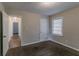 Well-lit bedroom with neutral walls, carpet flooring, and hallway access at 1784 Danrich Dr, Decatur, GA 30032