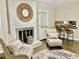 Open living room with a fireplace and kitchen bar at 2501 Henderson Mill Ne Rd, Atlanta, GA 30345
