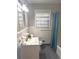Bright bathroom, featuring a white tile shower and vanity at 2501 Henderson Mill Ne Rd, Atlanta, GA 30345