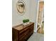 Bright entryway with a dresser, mirror, and plant adding a touch of elegance at 2501 Henderson Mill Ne Rd, Atlanta, GA 30345