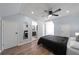 Spacious bedroom with hardwood floors and ceiling fan at 1368 New Hope Rd, Lawrenceville, GA 30045