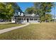 Charming one-story home with white exterior and black accents at 1368 New Hope Rd, Lawrenceville, GA 30045