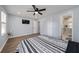 Primary bedroom with hardwood floors and ensuite bathroom at 1368 New Hope Rd, Lawrenceville, GA 30045