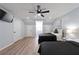 Spacious bedroom with two beds, ceiling fan, and ample closet space at 1368 New Hope Rd, Lawrenceville, GA 30045