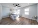 Bright bedroom with hardwood floors and ceiling fan at 1368 New Hope Rd, Lawrenceville, GA 30045