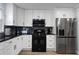 Modern kitchen with stainless steel appliances and dark countertops at 1368 New Hope Rd, Lawrenceville, GA 30045
