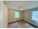 Vacant bedroom featuring neutral walls, carpeting, a ceiling fan, and two windows at 2986 Harlan Dr, Atlanta, GA 30344