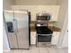 Stainless steel appliances in this bright kitchen at 5328 Sweetsprings Sw Way, Powder Springs, GA 30127