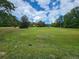 Spacious property with lush green lawn and mature trees at 25 Bryans Dr, Mcdonough, GA 30252