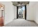 Bright bedroom with city view, ceiling fan, and plush carpeting at 950 W Peachtree Nw St # 1214, Atlanta, GA 30309