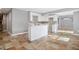 Basement kitchen with island and tile floor at 3601 Kasner Nw Ct, Kennesaw, GA 30144