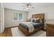 Cozy bedroom with a wooden bed frame and plenty of natural light at 1530 Chaparral Ne Pl, Atlanta, GA 30350