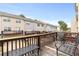 Private deck overlooking townhomes with seating at 2450 Mildon Hall Ln, Lawrenceville, GA 30043