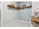 Laundry room with tile floor and built-in shelving at 802 Oak Promenade Ln, Canton, GA 30115