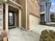 Townhouse exterior with brick and siding, plus attached garage at 2397 Sardis Chase Ct, Buford, GA 30519