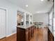 Kitchen island with granite countertop, offering extra prep space and seating at 2397 Sardis Chase Ct, Buford, GA 30519