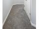 Hallway with grey carpeting and white doors at 2397 Sardis Chase Ct, Buford, GA 30519