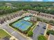 Aerial view of community amenities including tennis courts and swimming pool at 2397 Sardis Chase Ct, Buford, GA 30519