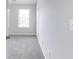 Simple bedroom with grey carpet and neutral walls at 2397 Sardis Chase Ct, Buford, GA 30519
