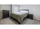 Bedroom with a dresser and green comforter at 2397 Sardis Chase Ct, Buford, GA 30519