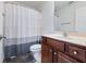 Clean bathroom with shower/tub combo, toilet and wood vanity at 2397 Sardis Chase Ct, Buford, GA 30519