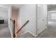 Upstairs hallway with neutral walls and carpet at 2397 Sardis Chase Ct, Buford, GA 30519