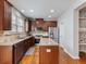Spacious kitchen with granite countertops, stainless steel appliances, and hardwood floors at 2397 Sardis Chase Ct, Buford, GA 30519