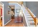 Bright entryway with hardwood floors, staircase, and charming decor at 3559 Gus Way, Powder Springs, GA 30127