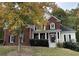Brick two-story house with a front porch and landscaping; American flag displayed at 3559 Gus Way, Powder Springs, GA 30127