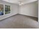 Spacious bedroom with carpet, ceiling fan and large window at 120 Birch Creek Cir, Mcdonough, GA 30253