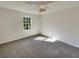 Bright bedroom with neutral carpeting and large window at 120 Birch Creek Cir, Mcdonough, GA 30253