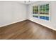 Dining area with hardwood floors and large windows offering natural light at 120 Birch Creek Cir, Mcdonough, GA 30253
