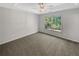 Well-lit bedroom with carpet flooring and large window at 120 Birch Creek Cir, Mcdonough, GA 30253