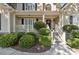 Two-story house with stone accents and a charming front porch at 1400 Lamont Cir, Dacula, GA 30019