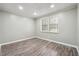 Simple bedroom with hardwood floors and neutral walls at 5271 Kelleys Mill Cir, Stone Mountain, GA 30088