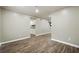 Hardwood floor living room with view into kitchen at 5271 Kelleys Mill Cir, Stone Mountain, GA 30088