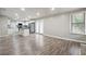 Open concept kitchen and living area with hardwood floors and island at 5271 Kelleys Mill Cir, Stone Mountain, GA 30088