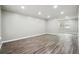 Spacious living room with gray walls and wood-look floors at 5271 Kelleys Mill Cir, Stone Mountain, GA 30088