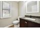 Modern bathroom with granite vanity and updated fixtures at 5271 Kelleys Mill Cir, Stone Mountain, GA 30088