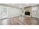 Living room features hardwood floors, stone fireplace, and lots of natural light at 5271 Kelleys Mill Cir, Stone Mountain, GA 30088