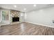 Living room with hardwood floors and a stone fireplace at 5271 Kelleys Mill Cir, Stone Mountain, GA 30088