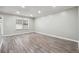Living room with hardwood floors and large windows at 5271 Kelleys Mill Cir, Stone Mountain, GA 30088