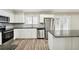 Modern kitchen with stainless steel appliances and granite countertops at 5271 Kelleys Mill Cir, Stone Mountain, GA 30088