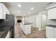 Open concept kitchen with island and granite countertops at 5271 Kelleys Mill Cir, Stone Mountain, GA 30088