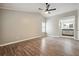 Main bedroom with hardwood floors, ceiling fan and ensuite bathroom at 5271 Kelleys Mill Cir, Stone Mountain, GA 30088