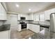 Modern kitchen with granite countertops and stainless steel appliances at 5271 Kelleys Mill Cir, Stone Mountain, GA 30088
