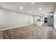 Open concept kitchen and living area with hardwood floors and island at 5271 Kelleys Mill Cir, Stone Mountain, GA 30088